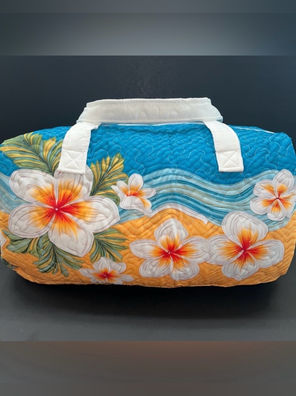 Quilted Floral Duffel Bag in a Turquoise, Orange & White Floral Pattern